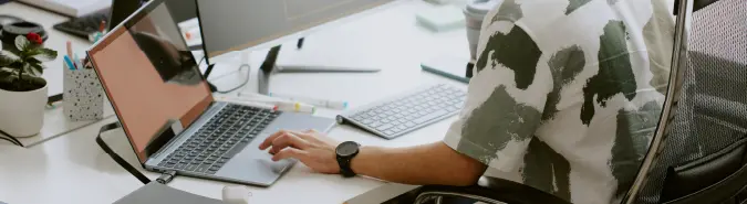 Developer working on Azure App Services at a workstation, showcasing streamlined business process development by Exigo Tech in Singapore