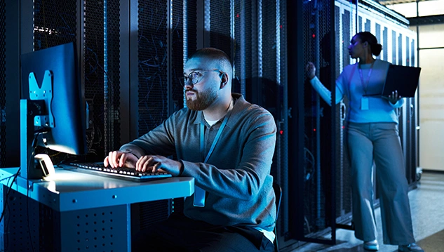 IT professionals managing server patches to prevent vulnerabilities and ensure compliance with the Essential Eight framework.