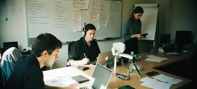 Team collaborating across multiple systems, highlighting data silos and integration challenges Team collaborating across multiple systems, highlighting data silos and integration challenges