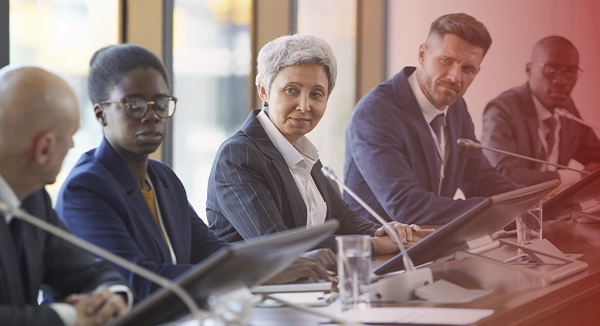 Business leaders discussing cybersecurity strategy and governance Business leaders discussing cybersecurity strategy and governance